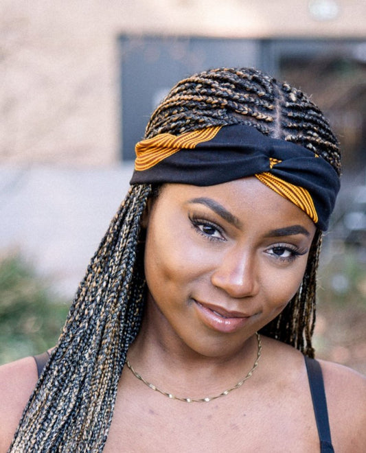 Black model wears yellow and black Tunde headband by Lolly and Kiks