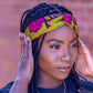 Black model wears yellow and pink Ife headband by Lolly and Kiks