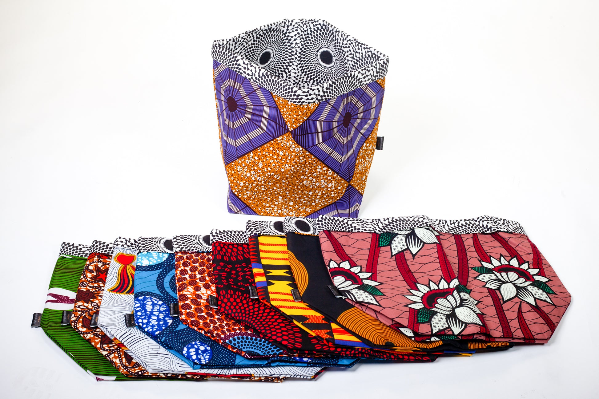A seclection of african print baskets laying down flat. Lolly & Kiks Fabric baskets