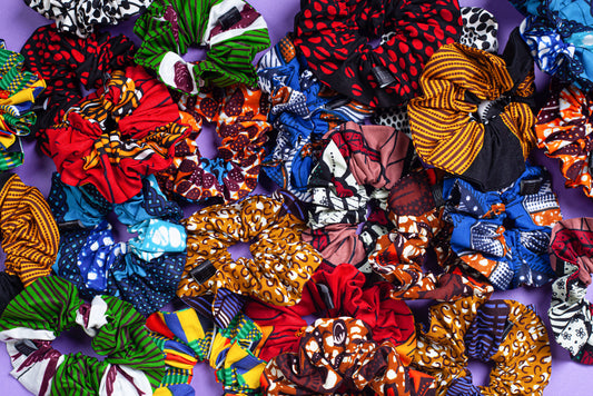 pile of handmade wax print scrunchies in different colours