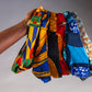 Model holds up range of Lolly and Kiks headbands in a variety of prints